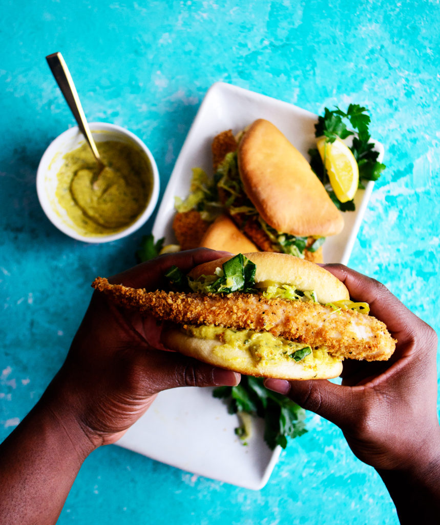 big mouth fish sandwich on homemade coco bread with ackee tartar sauce and slaw